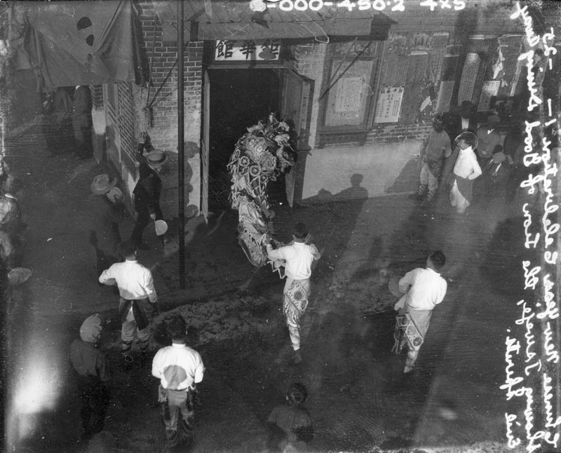 Tsweje, the Lion of Good, drives away evil spirits during this celebration of the Chinese New Year