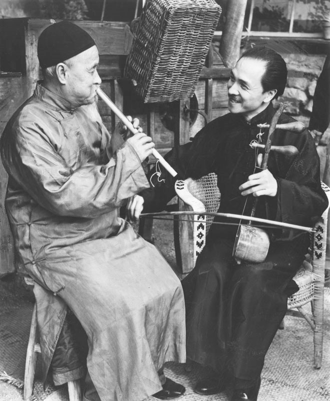 Chung Fook (left) and Luke Chan (right) play music to usher in the Chinese New Year