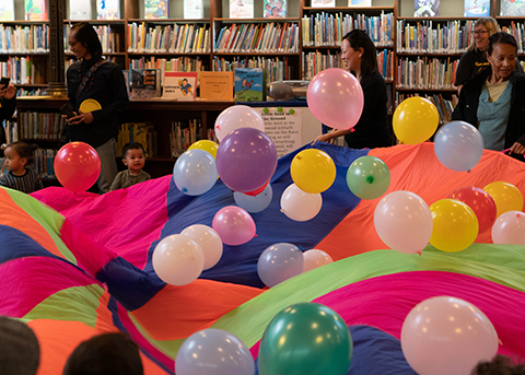 lots of colorful balloons during a library program
