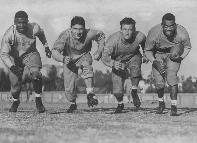 Portrait of four members of the UCLA football backfield including Jackie Robinson (left) and Kenny Washington (right)