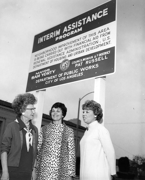 Councilwoman Pat Russell stands in the center of a group of women