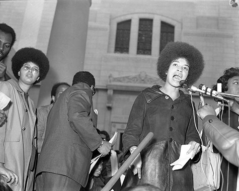 Angela Davis speaks from the Spring Street steps of City Hall during the community rally on December 11, 1969. 