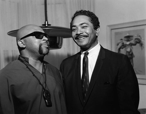 At left is author Ron Karenga, creator of the holiday Kwanza, with Mervyn Dymally, Assemblyman. 