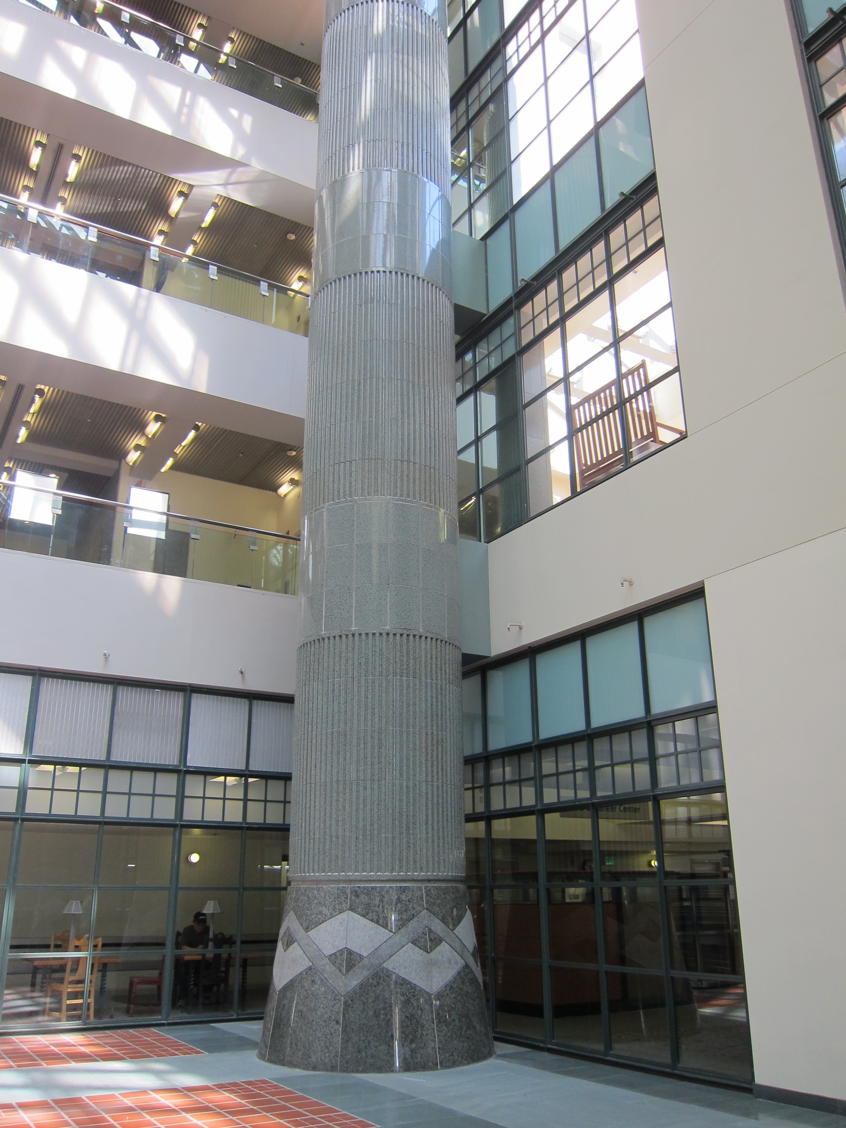 The magnificent atrium columns envelop steel posts with glazed terra cotta, accented by the ubiquitous chevrons. The design was inspired by Julian Garnsey's rotunda ceiling.