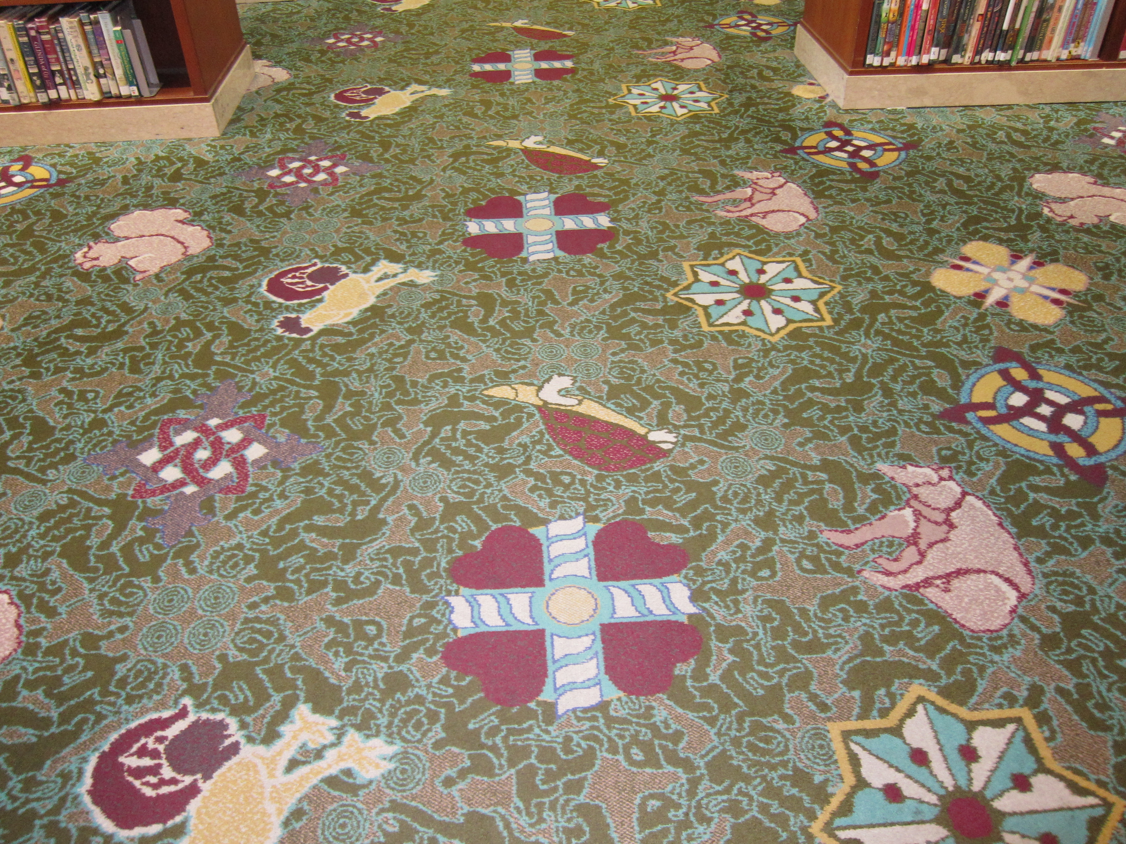 Pfeiffer designed the carpet in Children's as a whimsical homage to images in the Rotunda, including outlines of figures in Dean Cornwell's murals.