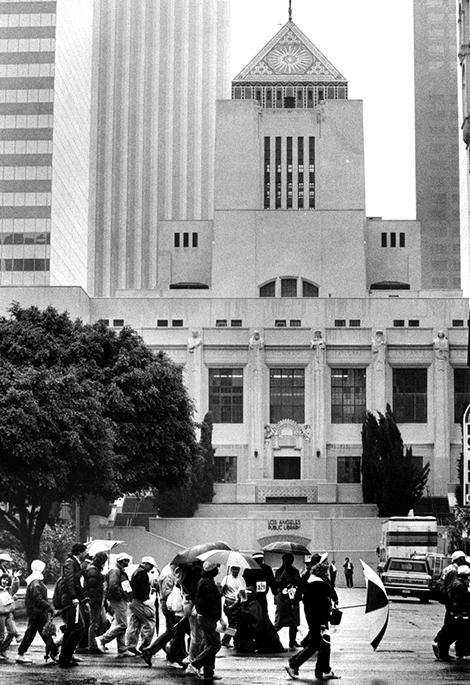 Walkathon participants stream past the Hope Street entrance of the shuttered Central Library