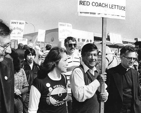 Chavez and Huerta walk with picket signs