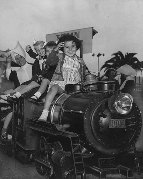 Orphans take a ride on the “Bud” Hurlbut miniature train at Nu-Pike