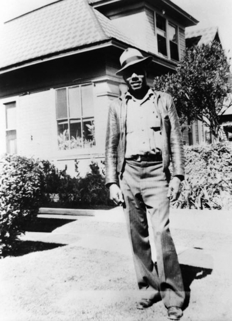 Raymond J. Austin poses in front of his home in Pomona, California, in 1945