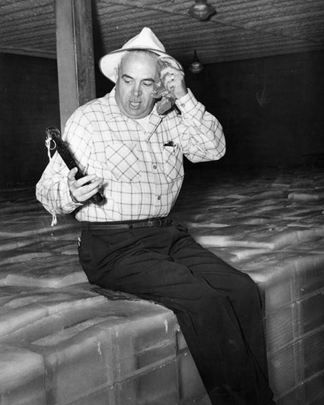 man sitting on giant blocks of ice