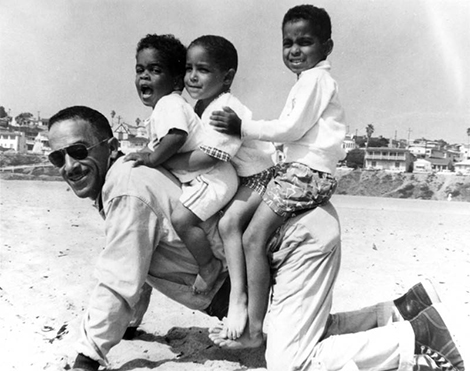 Man and boys horsing around at Santa Monica Beach