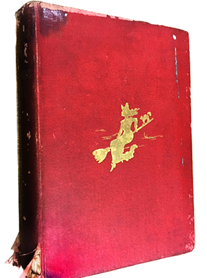 old red spooky book with a witch on the cover