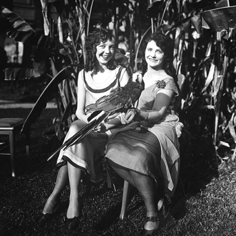 2 women with a parrot