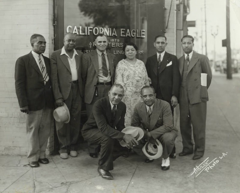 Charlotta Bass and a group of businessmen outside the California Eagle offices