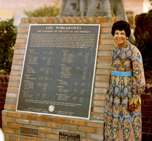 Founders Plaque with Miriam Matthews standing to the right of it
