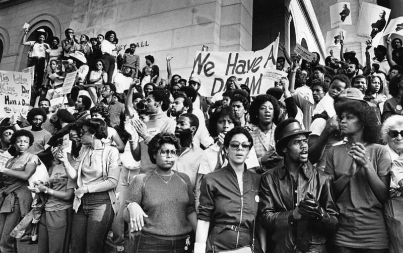 A crowd marches to city hall for MLK