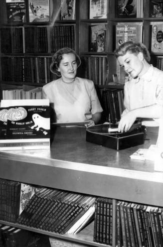 2 ladies looking at records, 1950