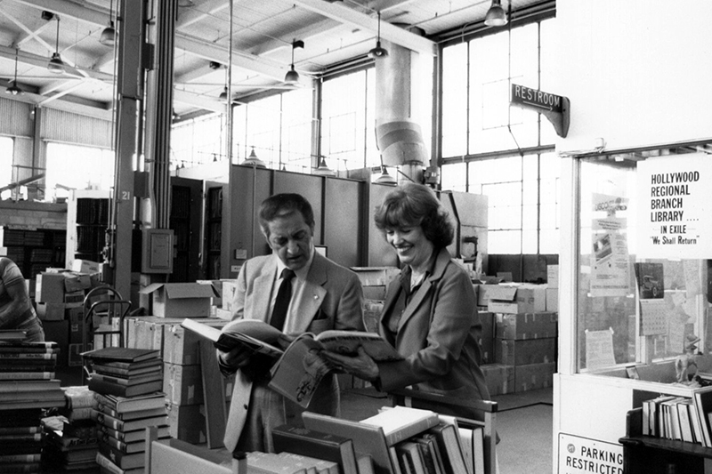 Librarian Georgette Todd shows entertainer and philanthropist Danny Thomas around the Anderson Street warehouse