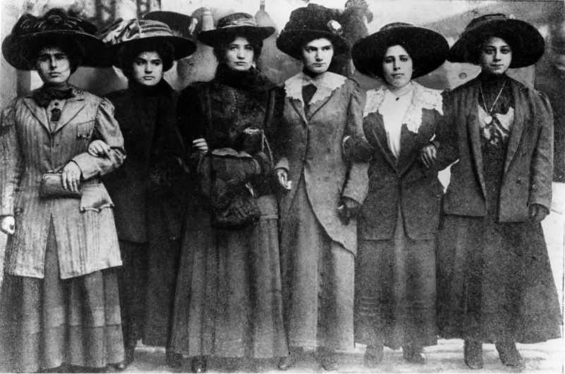 Six women linked arm in arm in their march to City Hall during the shirtwaist strike