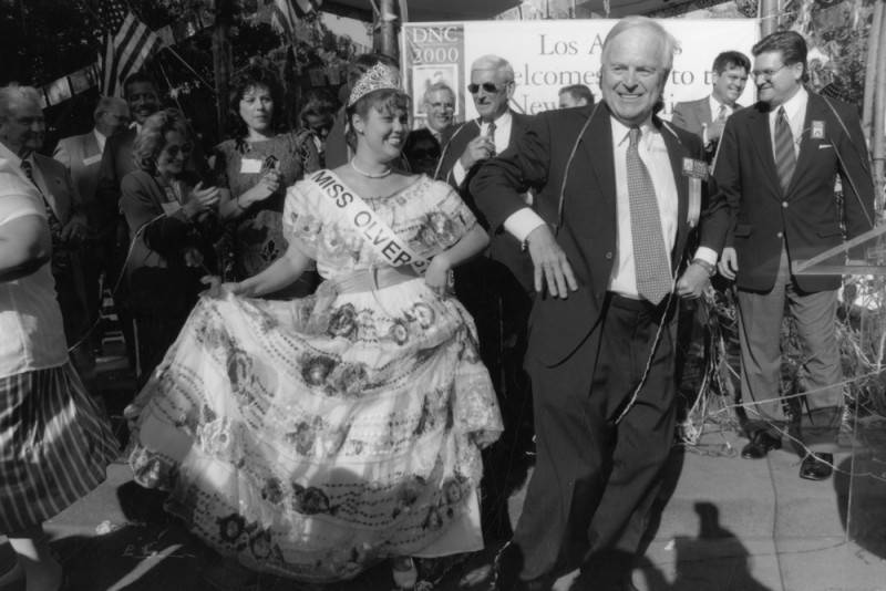 Mayor Riordan dances with Miss Olvera Street