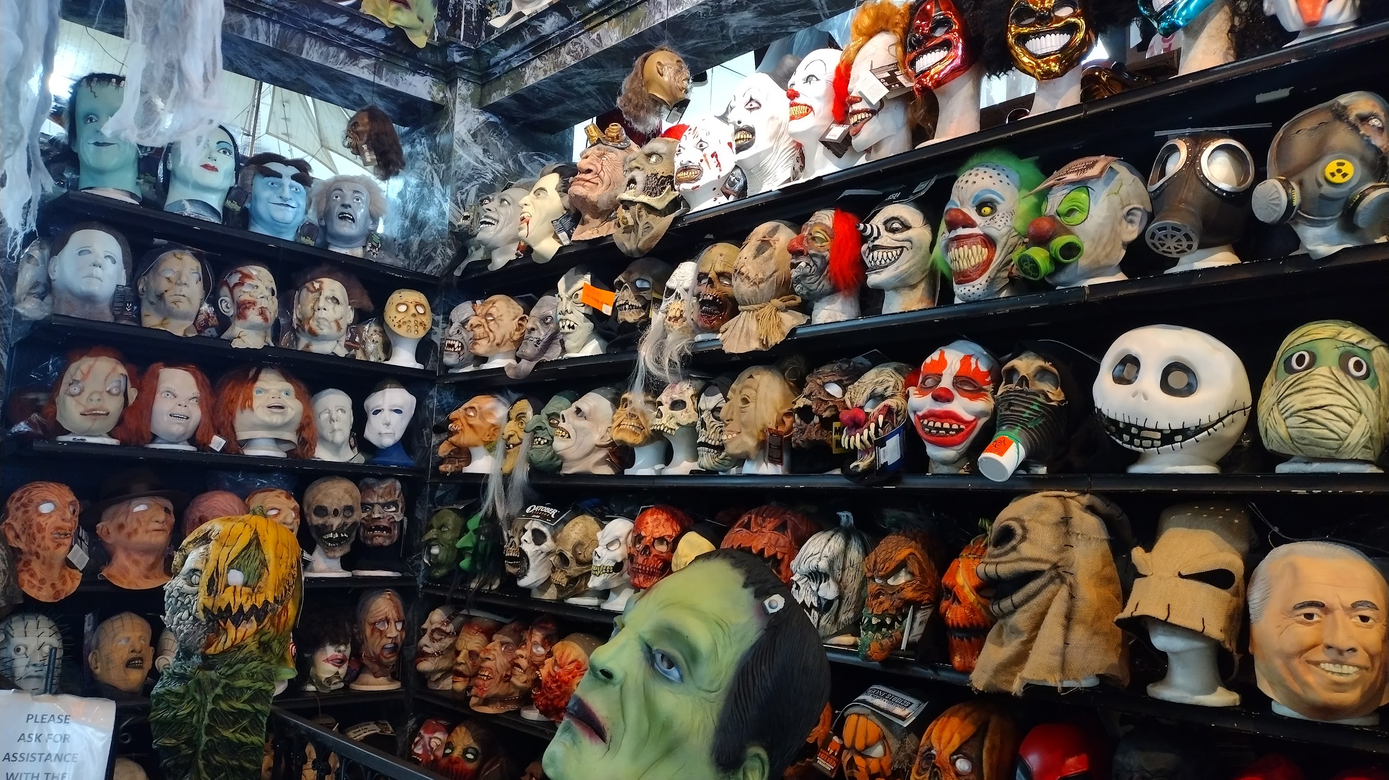 Latex masks at Hollywood Toys & Costumes retail store, 2024