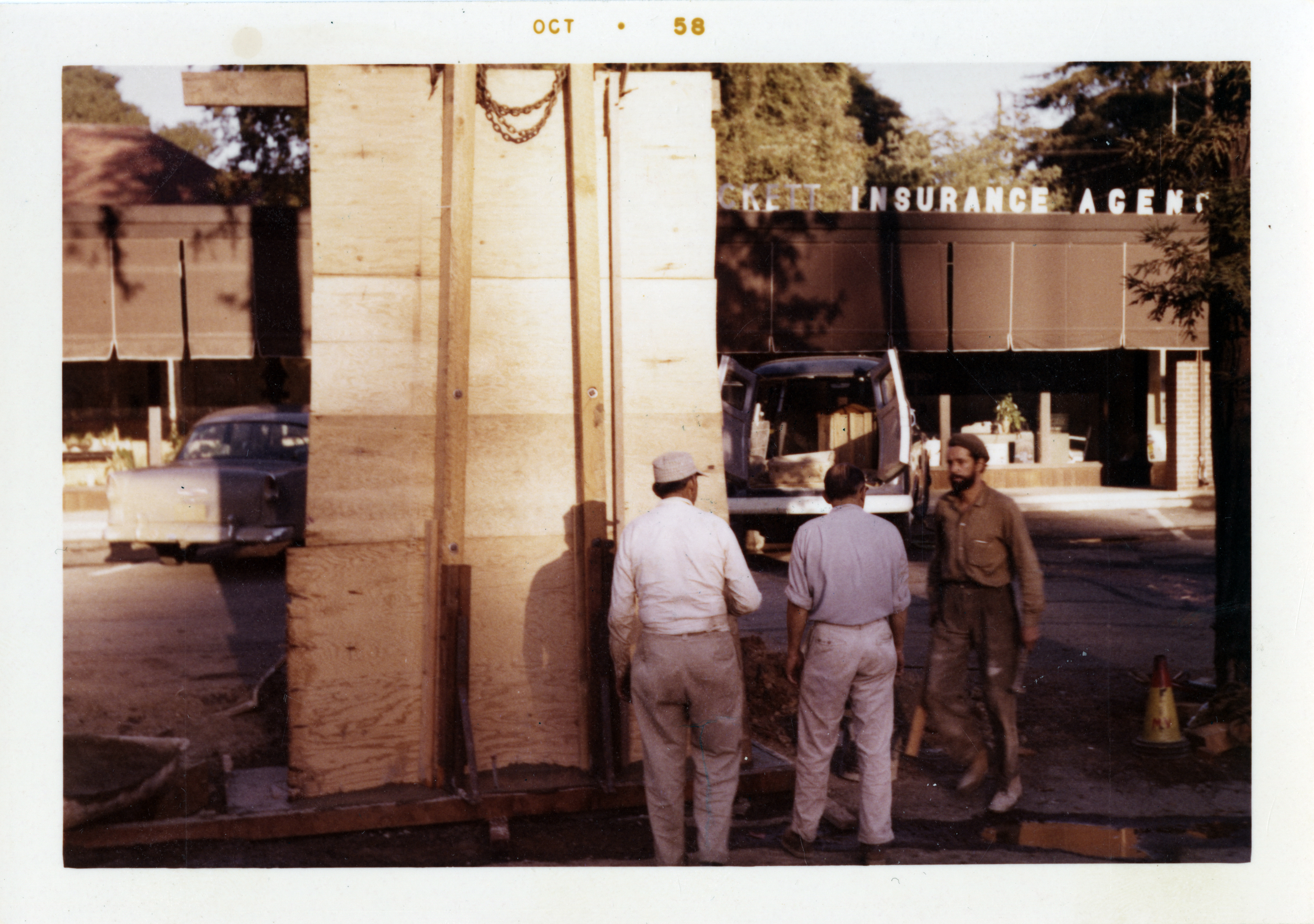 crew putting together mural