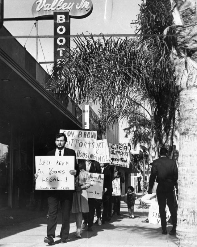 picketers in front of a bookstore