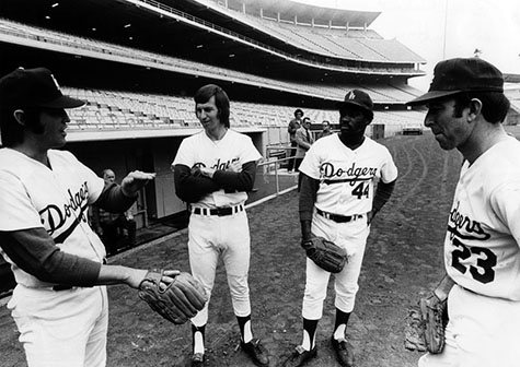 Dodger pitchers Pete Richert, Don Sutton, Al Downing and Claude Osteen take the field.
