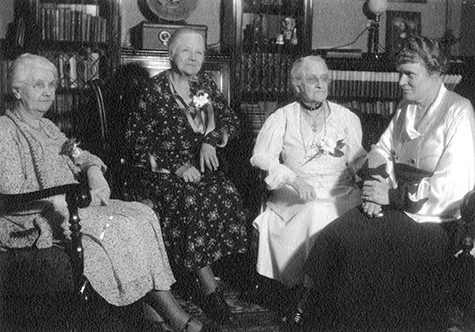 4 City Librarians of the Los Angeles Public Library. Left to right: Mary L. Jones, Mary E. Foy, Harriet Child Wadleigh, Althea Warren. Photo taken at the home of Mrs. Wadleigh, 1415 S. Hope St. (April, 1934)