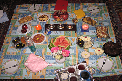 A table cloth with a variety of Yalda favorites taken