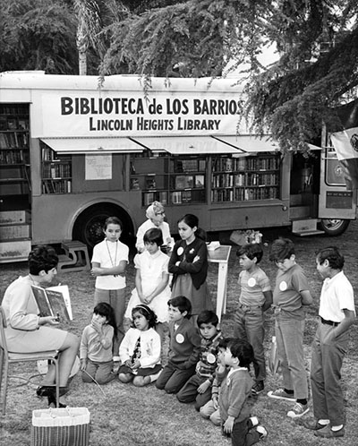 children in front of a Los Angeles Public Library Traveling Branch