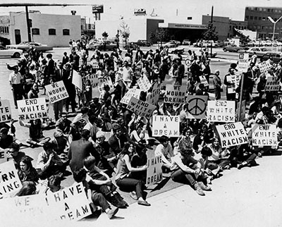 Marchers with signs gather to mourn Rev. Martin Luther King, Jr.