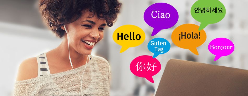 woman at computer with headphones with speech bubbles saying hello in different languages