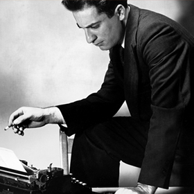 portrait of man with cigarette and typewriter